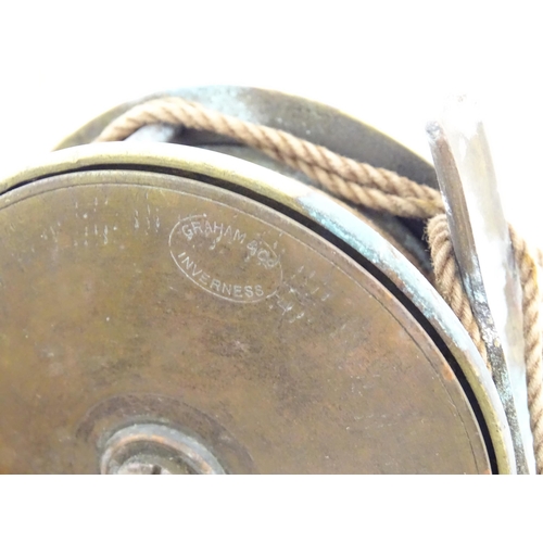 874 - Fishing : a quantity of vintage tackle, comprising a 19thC Graham of Inverness centrepin reel, of br... 