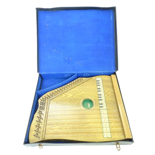 894 - Musical Instrument: a mid 20thC cased zither / autoharp, bearing interior label: 'Supertone Stringed... 