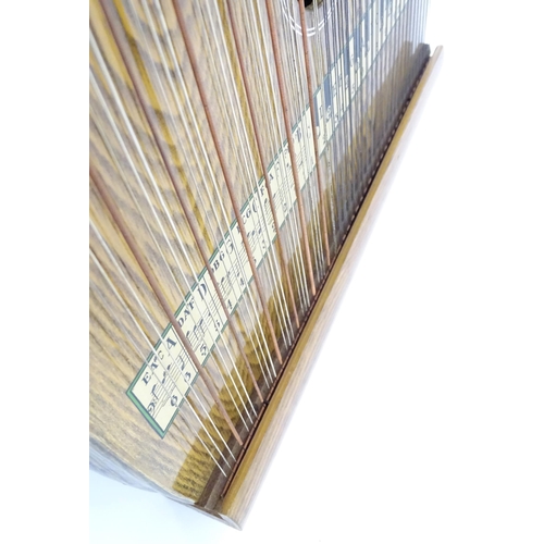 894 - Musical Instrument: a mid 20thC cased zither / autoharp, bearing interior label: 'Supertone Stringed... 