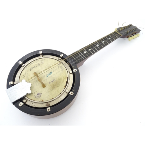 895 - Musical Instrument: a mid 20thC cased Banjo Mandolin, the head bearing various autographs, approx 22... 