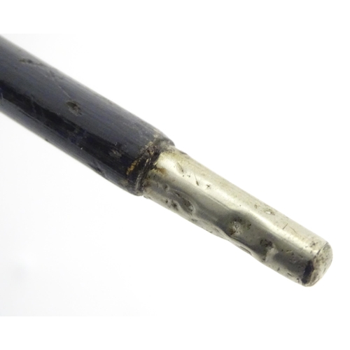 898 - A late 19th / early 20thC conductors baton with engraved silver plate mounts. Approx. 14 3/4