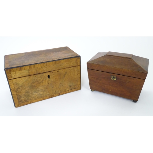 899 - A 19thC walnut tea caddy with crossbanding, opening to reveal two hinge lidded sections within. Toge... 