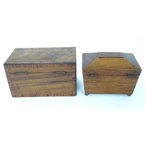 899 - A 19thC walnut tea caddy with crossbanding, opening to reveal two hinge lidded sections within. Toge... 