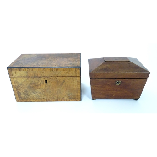 899 - A 19thC walnut tea caddy with crossbanding, opening to reveal two hinge lidded sections within. Toge... 