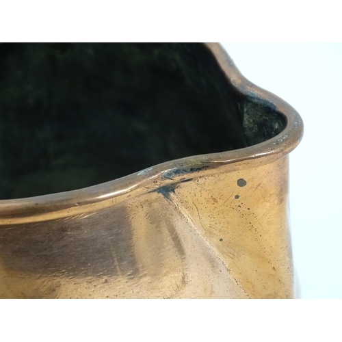 900 - A 19thC copper saucepan with spout and turned wooden handle. Approx. 14 1/4