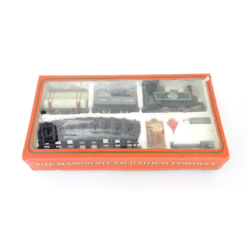 119B - Toy: A Mamod model Live Steam Railway Goods Train set RS1, with locomotive, wagons, track, etc. With... 