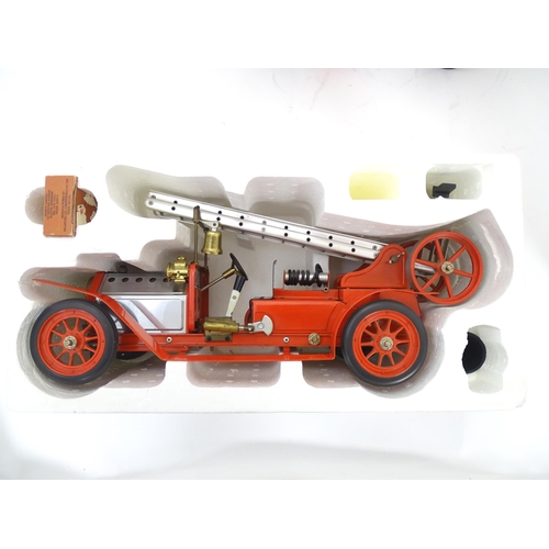 119D - Toys: A Mamod model Live Steam Fire Engine FE1, with original box. Together with a Mamod Lumber Wago... 