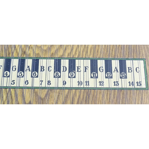 894 - Musical Instrument: a mid 20thC cased zither / autoharp, bearing interior label: 'Supertone Stringed... 