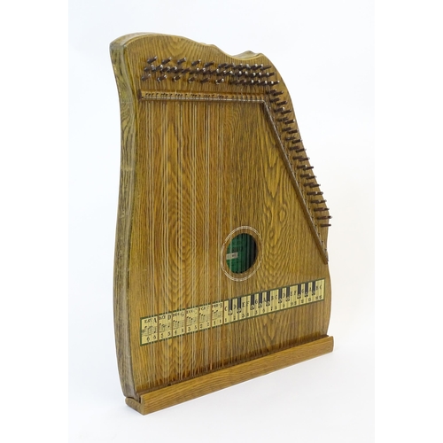 894 - Musical Instrument: a mid 20thC cased zither / autoharp, bearing interior label: 'Supertone Stringed... 