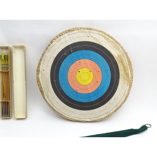 878 - Mid 20thC Archery items, comprising two wooden bows with cloth cases, one marked F H Ayres, London -... 