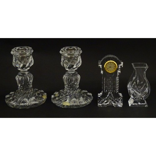 104 - A quantity of assorted crystal / glassware to include a pair of candlesticks by Baccarat, together w... 