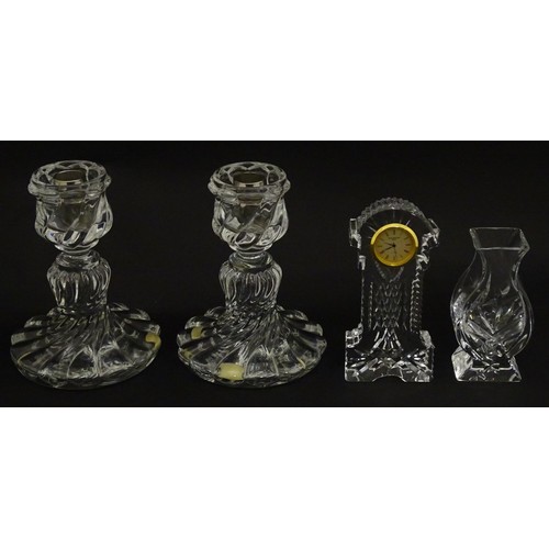 104 - A quantity of assorted crystal / glassware to include a pair of candlesticks by Baccarat, together w... 