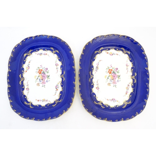 167 - A pair of Victorian blue and white meat plates with floral and foliate decoration. Marked under Dani... 