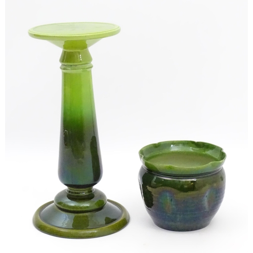 182 - A late 19th / early 20thC Bretby jardiniere / planter on stand with a green glaze. Stand stamped 143... 