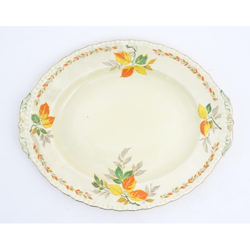 189 - A quantity of Grindley dinner wares in the pattern The Holly Leaves, to include oval serving plates,... 