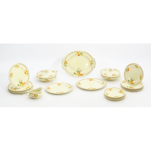 189 - A quantity of Grindley dinner wares in the pattern The Holly Leaves, to include oval serving plates,... 