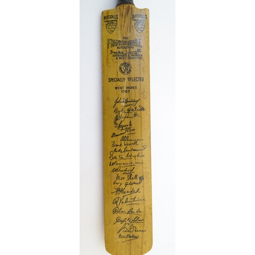 879 - A late 20thC Duncan Fearnley Supreme cricket bat, bearing the autographs of Leicestershire County Cr... 