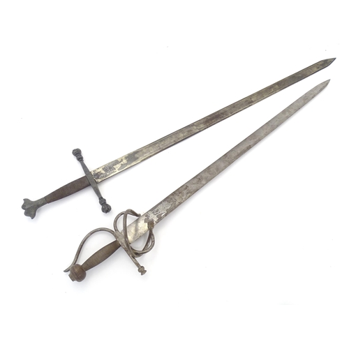 1803 - Militaria / Arms & Armour : two 20thC Spanish swords, comprising a Colada (with 33 3/4