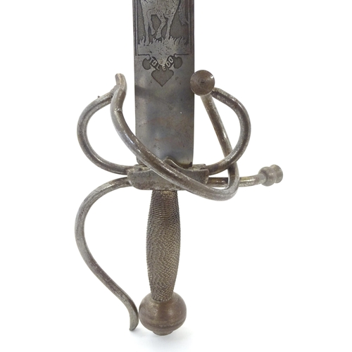 1803 - Militaria / Arms & Armour : two 20thC Spanish swords, comprising a Colada (with 33 3/4