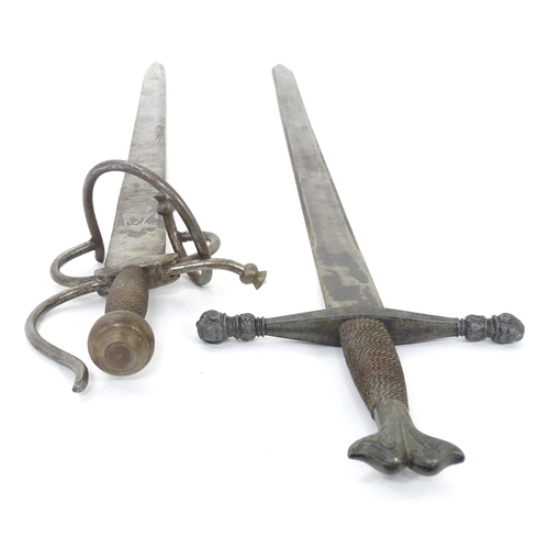 1803 - Militaria / Arms & Armour : two 20thC Spanish swords, comprising a Colada (with 33 3/4