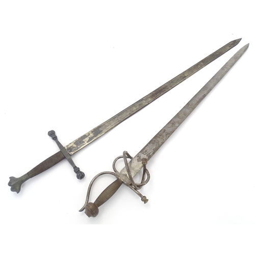 1803 - Militaria / Arms & Armour : two 20thC Spanish swords, comprising a Colada (with 33 3/4