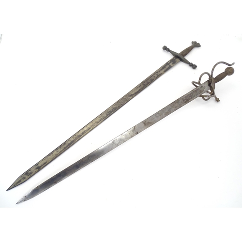 1803 - Militaria / Arms & Armour : two 20thC Spanish swords, comprising a Colada (with 33 3/4