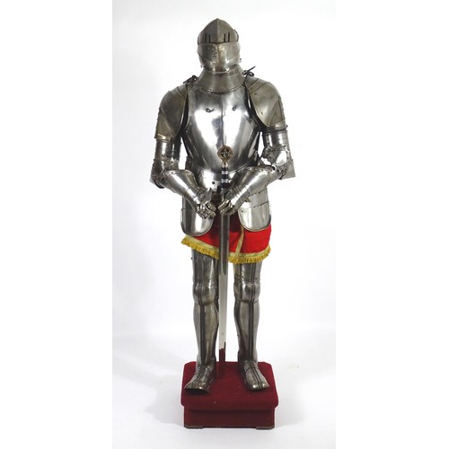 1817 - Militaria: a 20thC medieval style suit of armour, constructed from articulated steel panels and moun... 