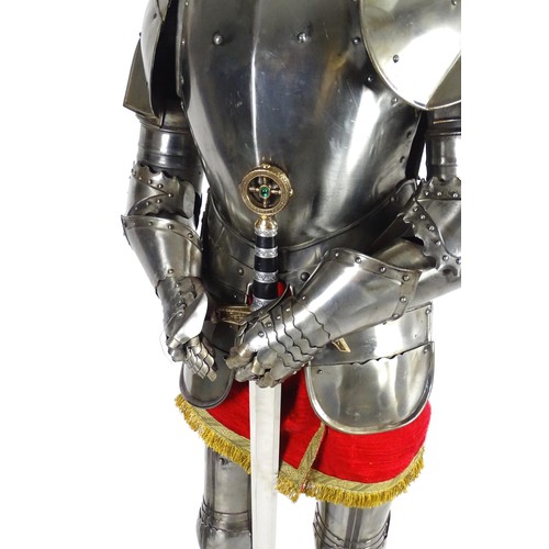 1817 - Militaria: a 20thC medieval style suit of armour, constructed from articulated steel panels and moun... 