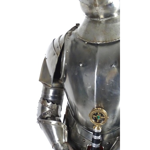 1817 - Militaria: a 20thC medieval style suit of armour, constructed from articulated steel panels and moun... 