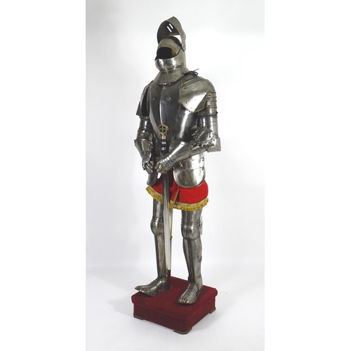 1817 - Militaria: a 20thC medieval style suit of armour, constructed from articulated steel panels and moun... 