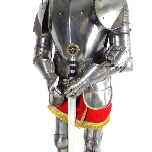 1817 - Militaria: a 20thC medieval style suit of armour, constructed from articulated steel panels and moun... 