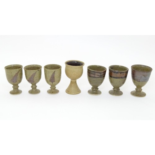 22 - A quantity of assorted Scottish studio pottery goblets / pedestal cups, some with fern detail. Large... 