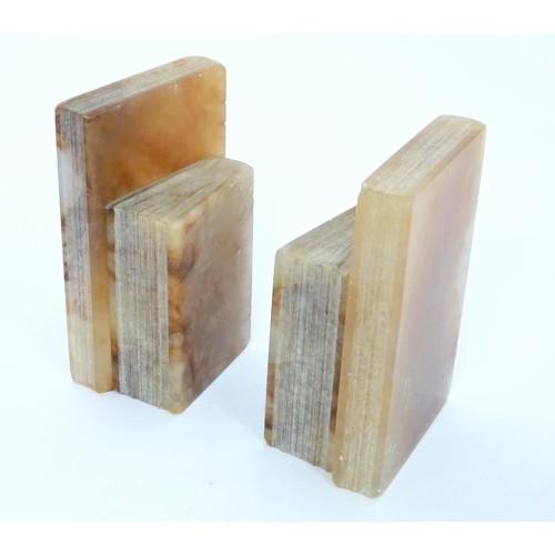 23 - A pair of alabaster bookends formed as books, each approx 6