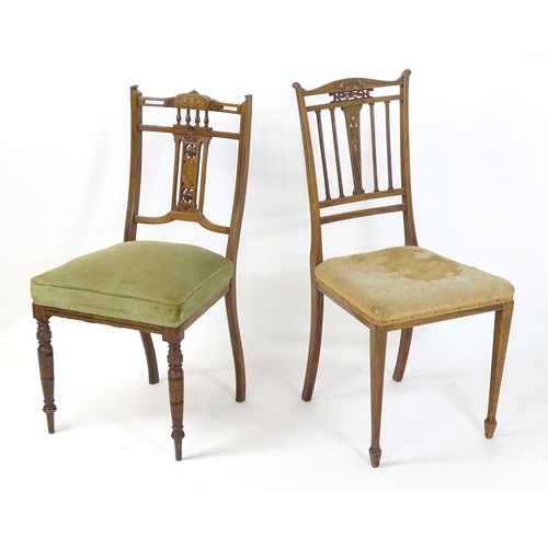 26 - Two Edwardian rosewood chairs, having inlaid and pierced backrests. 35