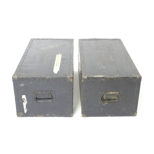 29 - Militaria: a mid 20thC pair of crates / step mounts , in black painted finish with metal handles. On... 