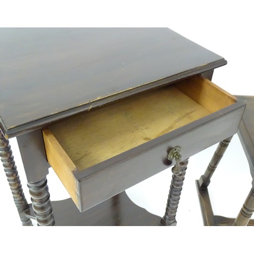 31 - An oak table with one small drawer, together with an oak stool. (2)
