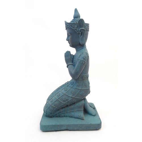 65 - A cast composite model of a kneeling Buddha. Approx. 25