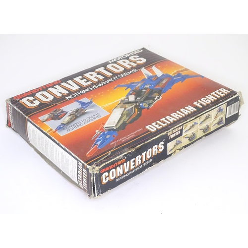 67 - Toy : a late 20thC boxed Grandstand Convertors series Mironauts Deltarian Fighter, approx. 11