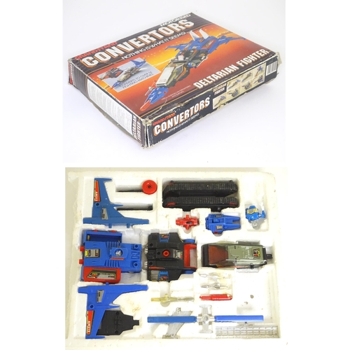 67 - Toy : a late 20thC boxed Grandstand Convertors series Mironauts Deltarian Fighter, approx. 11