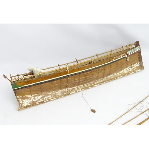 69 - A model of a sail boat, the hull titled Love and Peace. Approx 48