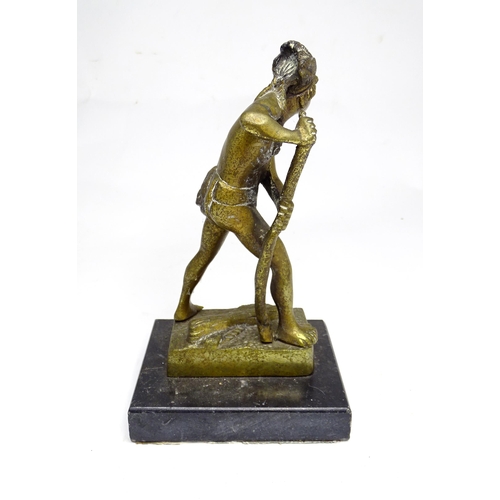 19 - A cast brass tribal figure with a feather headdress, approx 8