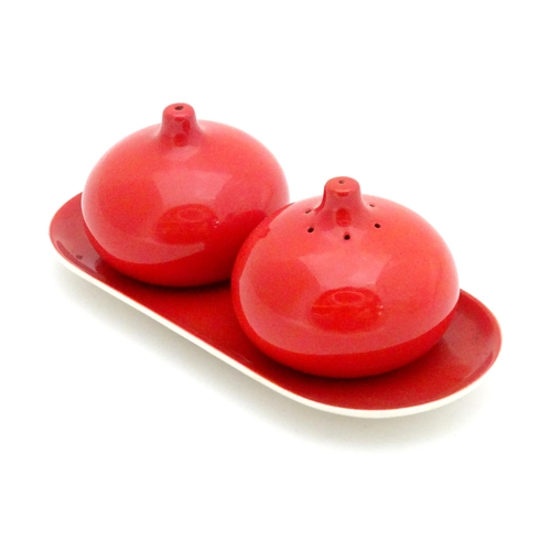 33 - A Carlton Ware cruet set on stand with a red glaze. Marked and impressed under 2955
