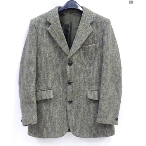 51 - A Harris Tweed hacking jacket by Gurtex, with three buttons to front and single vent to rear, measur... 