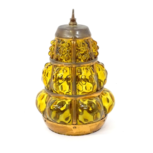 43 - An Arts and Crafts style pendant shade with amber glass panels and copper banding. Approx 10 1/2
