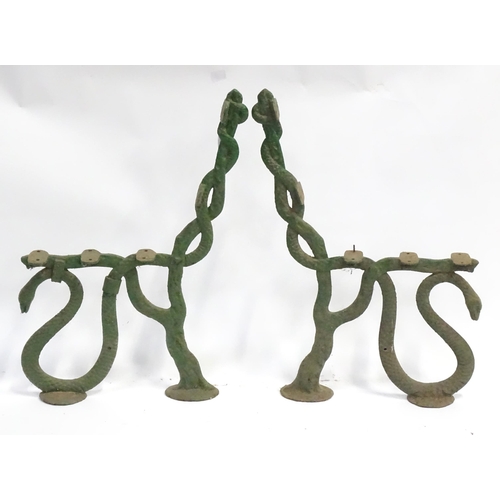 49 - A pair of Coalbrookdale style bench ends with serpent decoration. Each approx 24