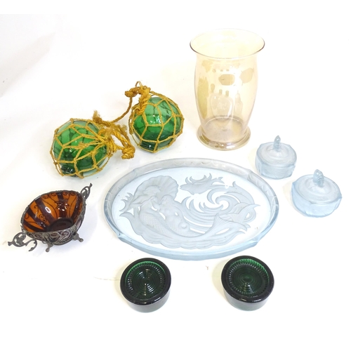 56 - A quantity of assorted glass items to include vase, piano casters, fishing floats, dressing table it... 