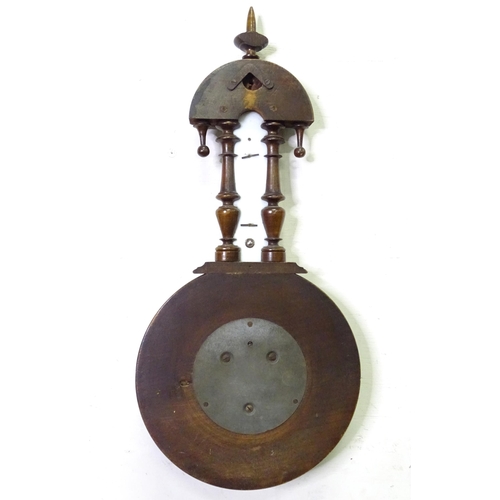 71 - An aneroid barometer / thermometer within a carved wooden surround. Approx 16