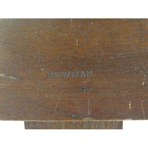 104 - An adjustable artist's easel, marked Newman.