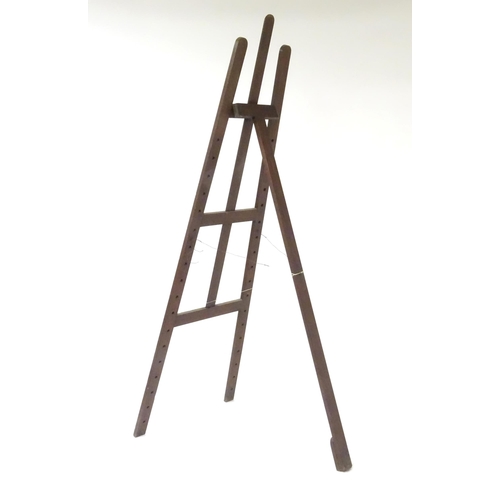 104 - An adjustable artist's easel, marked Newman.