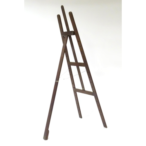 104 - An adjustable artist's easel, marked Newman.